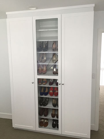 Custom Closets with Shoe Selves, Glass Doors and Knob